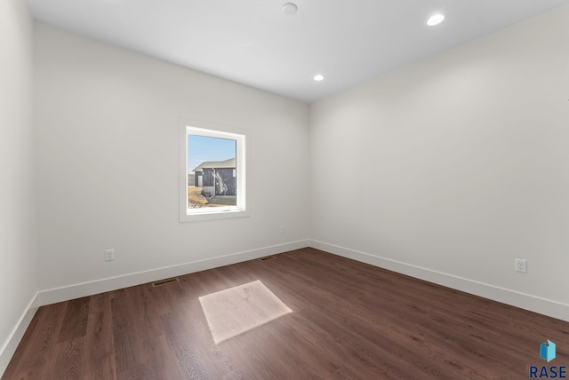 8309 E Sheridan Cir, Sioux Falls, SD 57110 - empty room featuring baseboards, dark wood-style floors, and recessed lighting