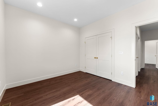 8309 E Sheridan Cir, Sioux Falls, SD 57110 - unfurnished bedroom featuring dark wood-style floors, baseboards, and recessed lighting