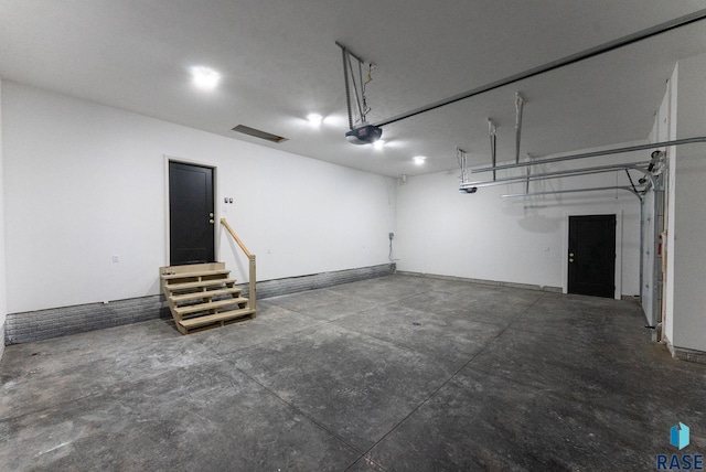 8309 E Sheridan Cir, Sioux Falls, SD 57110 - garage featuring a garage door opener and baseboards