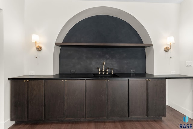 8309 E Sheridan Cir, Sioux Falls, SD 57110 - indoor wet bar featuring dark wood finished floors and baseboards