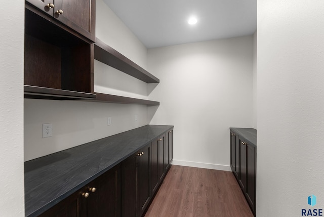 8309 E Sheridan Cir, Sioux Falls, SD 57110 - bar with dark wood-type flooring and baseboards
