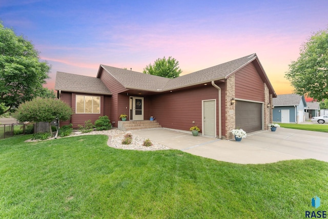 7721 W Ione St, Sioux Falls, SD 57106 - ranch-style house featuring a garage, driveway, a front yard, and roof with shingles