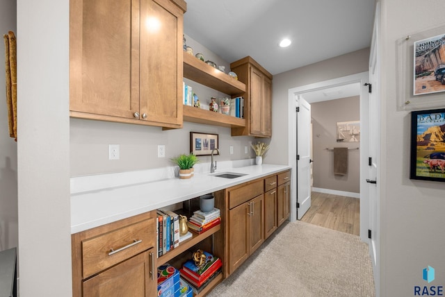 1703 N Otto Ave, Sioux Falls, SD 57110 - kitchen with a sink, open shelves, light countertops, recessed lighting, and light wood-style flooring
