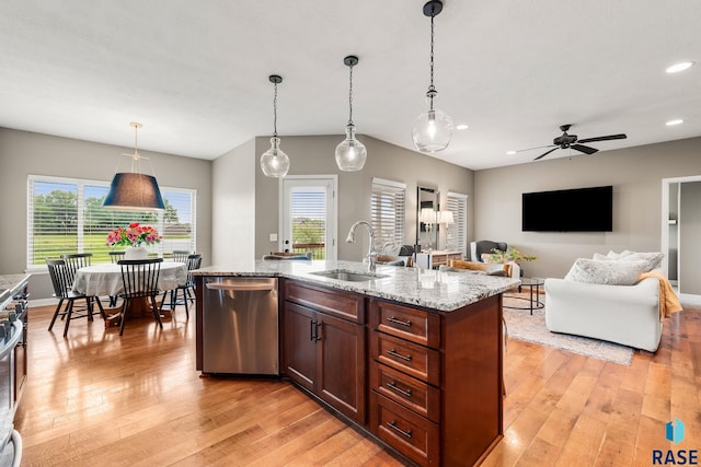 8216 W 51st St, Sioux Falls, SD 57106 - kitchen with appliances with stainless steel finishes, a sink, light wood-type flooring, decorative light fixtures, and recessed lighting