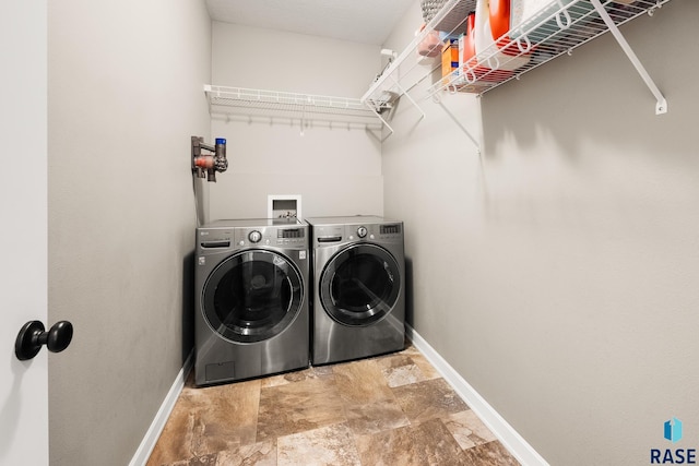 8216 W 51st St, Sioux Falls, SD 57106 - laundry room featuring separate washer and dryer, baseboards, and stone finish floors