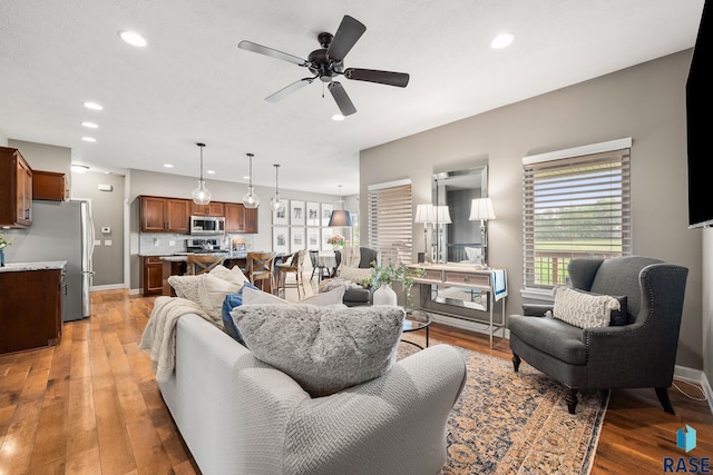 8216 W 51st St, Sioux Falls, SD 57106 - living area with recessed lighting, a ceiling fan, light wood-style floors, and baseboards