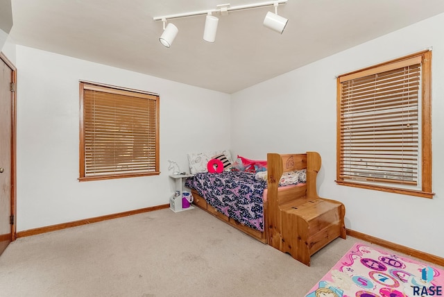 1705 W 10th St, Sioux Falls, SD 57104 - bedroom with carpet flooring, baseboards, and ceiling fan