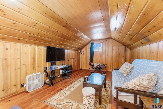 1705 W 10th St, Sioux Falls, SD 57104 - living room with wooden walls, hardwood / wood-style flooring, lofted ceiling, wood ceiling, and baseboards