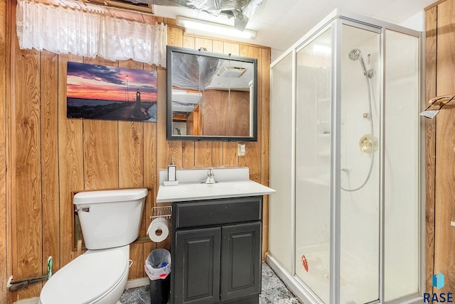 1705 W 10th St, Sioux Falls, SD 57104 - bathroom featuring vanity, wooden walls, a shower stall, and toilet