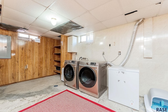 1705 W 10th St, Sioux Falls, SD 57104 - laundry room featuring independent washer and dryer, wooden walls, and electric panel