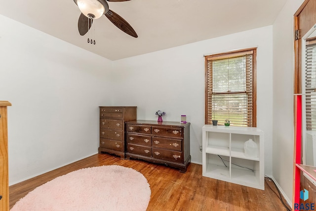 1705 W 10th St, Sioux Falls, SD 57104 - bedroom with wood finished floors, ceiling fan, and baseboards