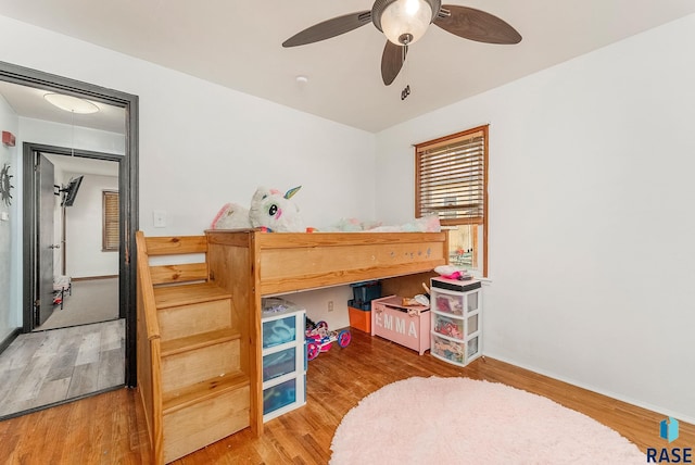 1705 W 10th St, Sioux Falls, SD 57104 - bedroom with wood finished floors, ceiling fan, and baseboards