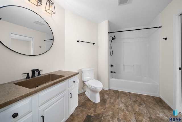 5600 W Darcie St, Sioux Falls, SD 57106 - full bath featuring vanity, toilet, stone finish flooring, and baseboards