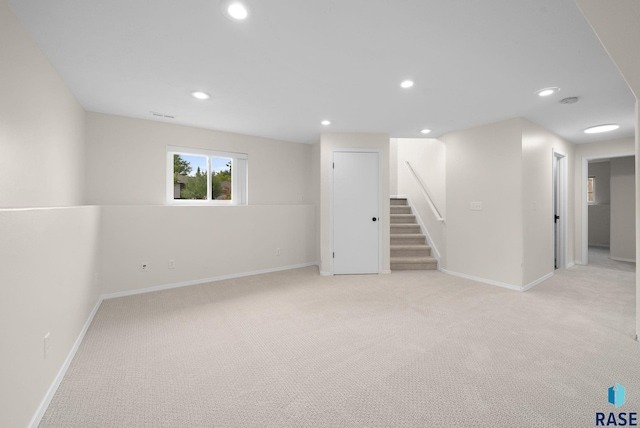 5600 W Darcie St, Sioux Falls, SD 57106 - below grade area featuring stairway, carpet, baseboards, and recessed lighting