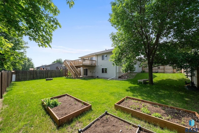 5600 W Darcie St, Sioux Falls, SD 57106 - view of yard featuring a garden, stairway, and a wooden deck
