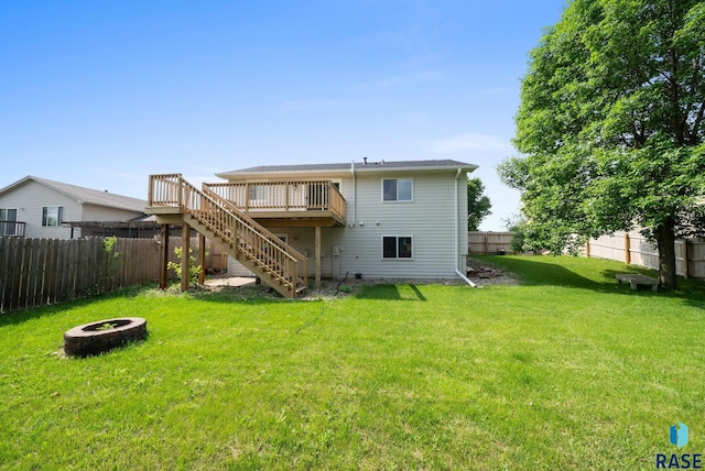 5600 W Darcie St, Sioux Falls, SD 57106 - rear view of house featuring a fire pit, stairway, and a deck
