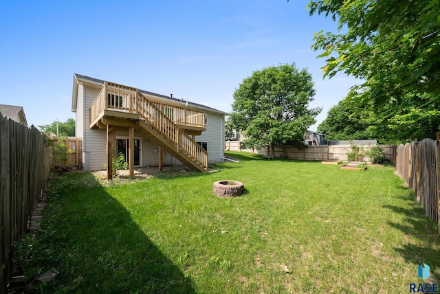 5600 W Darcie St, Sioux Falls, SD 57106 - back of house featuring stairway, a fire pit, and a wooden deck