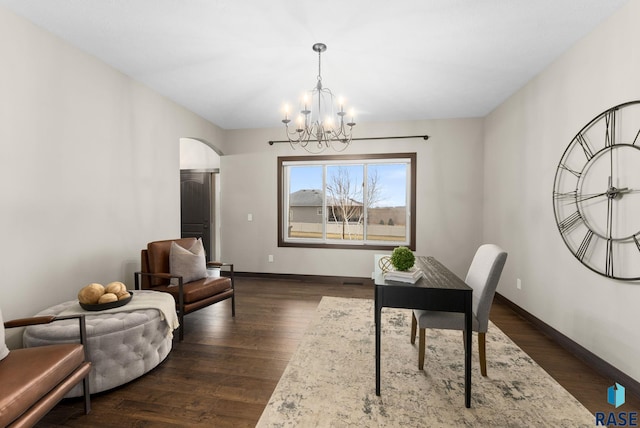 2101 S Meadowview Ave, Sioux Falls, SD 57110 - office area with a chandelier, arched walkways, baseboards, and dark wood-style floors