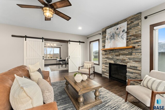 2101 S Meadowview Ave, Sioux Falls, SD 57110 - living area featuring a barn door, wood finished floors, plenty of natural light, ceiling fan, and recessed lighting