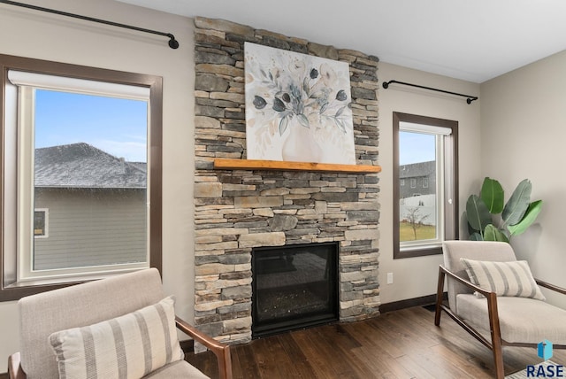 2101 S Meadowview Ave, Sioux Falls, SD 57110 - living room with wood-type flooring, a fireplace, and baseboards