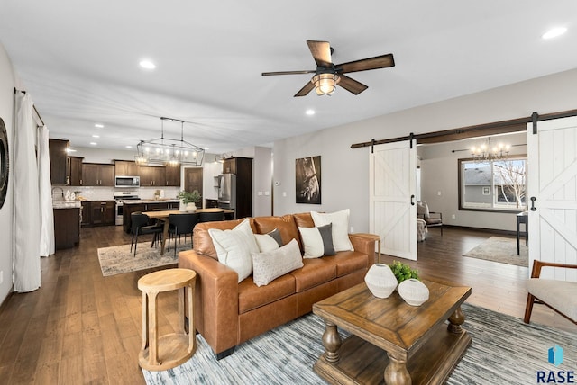 2101 S Meadowview Ave, Sioux Falls, SD 57110 - living room with a barn door, dark wood-type flooring, recessed lighting, and a ceiling fan