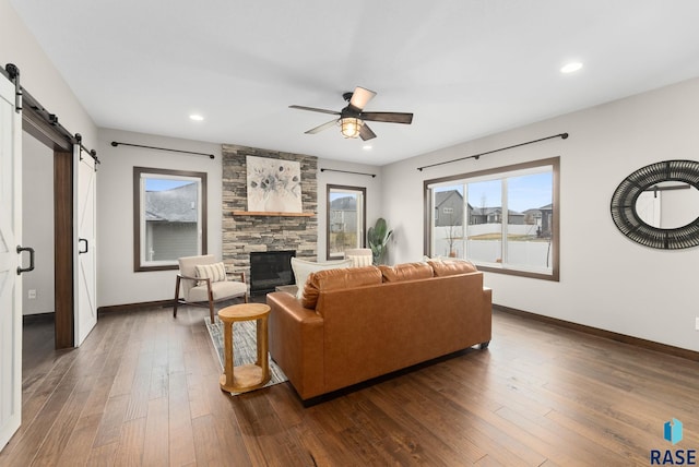 2101 S Meadowview Ave, Sioux Falls, SD 57110 - living area featuring a barn door, a ceiling fan, dark wood finished floors, baseboards, and recessed lighting