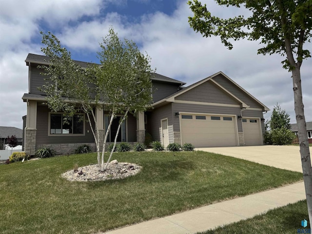 2101 S Meadowview Ave, Sioux Falls, SD 57110 - craftsman-style house with a garage, a front lawn, and concrete driveway