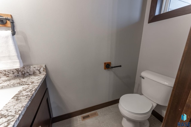 2101 S Meadowview Ave, Sioux Falls, SD 57110 - bathroom with vanity, toilet, and baseboards