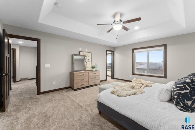 2101 S Meadowview Ave, Sioux Falls, SD 57110 - bedroom featuring a raised ceiling, light colored carpet, baseboards, ceiling fan, and recessed lighting