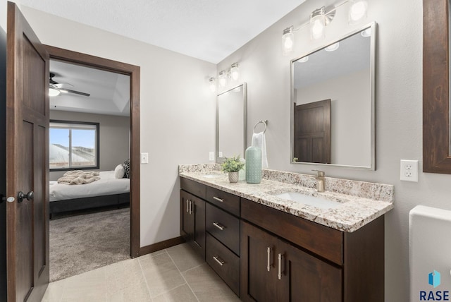 2101 S Meadowview Ave, Sioux Falls, SD 57110 - ensuite bathroom with double vanity, baseboards, tile patterned flooring, and ceiling fan