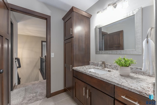 2101 S Meadowview Ave, Sioux Falls, SD 57110 - bathroom with vanity, tile patterned floors, and baseboards