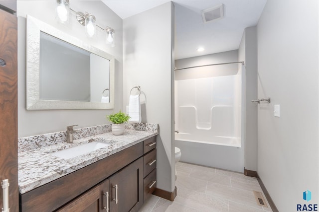 2101 S Meadowview Ave, Sioux Falls, SD 57110 - full bath with toilet, baseboards, vanity, and tub / shower combination
