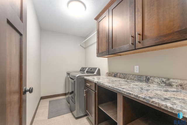 2101 S Meadowview Ave, Sioux Falls, SD 57110 - laundry room featuring cabinet space, washing machine and clothes dryer, and baseboards