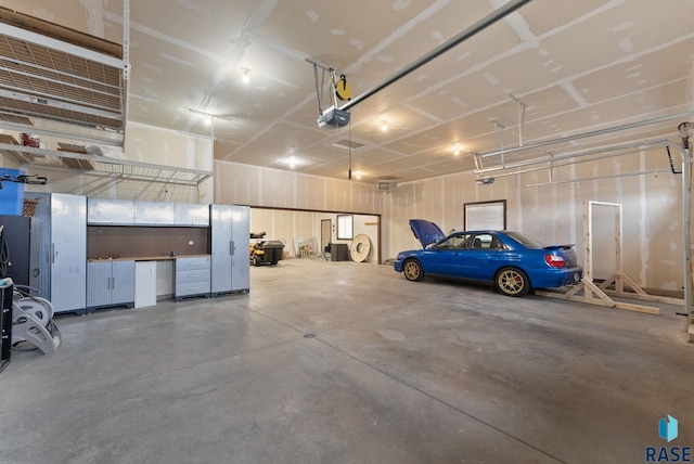2101 S Meadowview Ave, Sioux Falls, SD 57110 - garage featuring a garage door opener