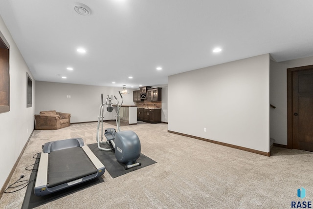 2101 S Meadowview Ave, Sioux Falls, SD 57110 - exercise area featuring recessed lighting, light carpet, baseboards, and wet bar