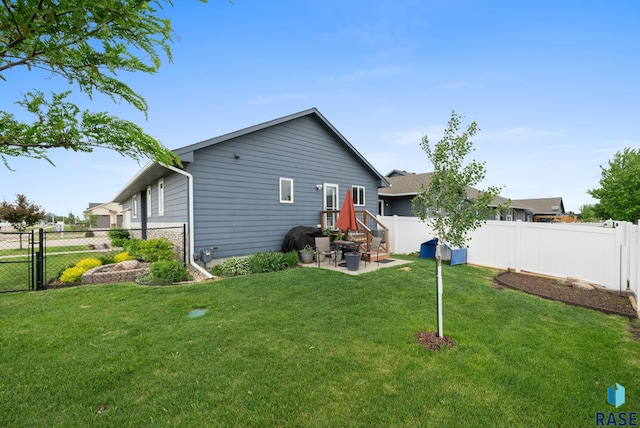 8620 W 22nd St, Sioux Falls, SD 57106 - back of house featuring a fenced backyard, a patio area, and a gate