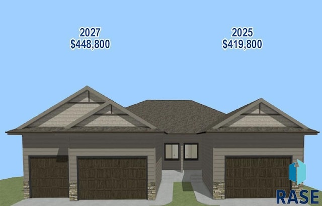 2027 S Sonoma Pl, Sioux Falls, SD 57106 - view of front of property with an attached garage, stone siding, and concrete driveway