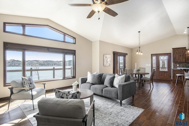 26017 Hideaway Pl, Canistota, SD 57012 - living room with vaulted ceiling, ceiling fan, dark wood-style floors, and a water view