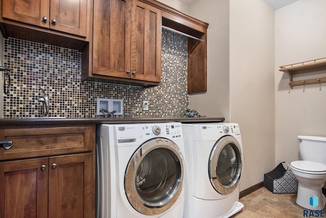 26017 Hideaway Pl, Canistota, SD 57012 - laundry area featuring washer and dryer and baseboards