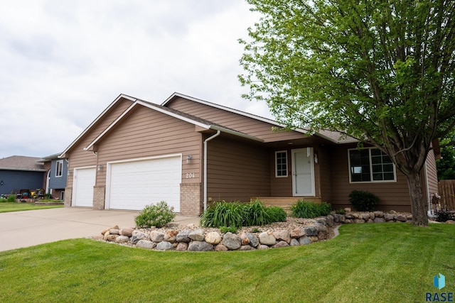 204 W Mountain Ash St, Brandon, SD 57005 - ranch-style house featuring brick siding, a garage, driveway, and a front yard