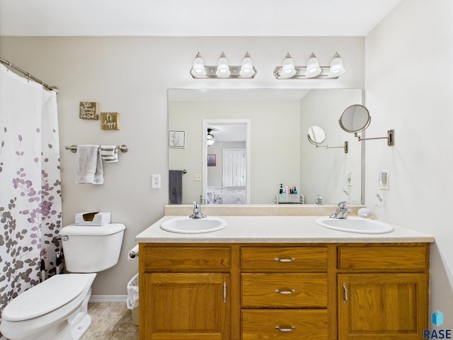 204 W Mountain Ash St, Brandon, SD 57005 - bathroom featuring double vanity, ensuite bathroom, ceiling fan, and a shower with shower curtain