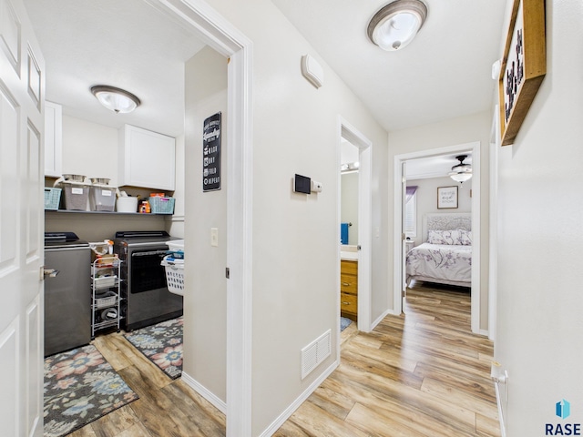 204 W Mountain Ash St, Brandon, SD 57005 - hall with light wood-style floors and washing machine and dryer