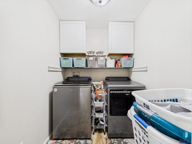 204 W Mountain Ash St, Brandon, SD 57005 - washroom featuring separate washer and dryer, cabinet space, and wood finished floors