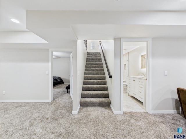 204 W Mountain Ash St, Brandon, SD 57005 - staircase with carpet floors
