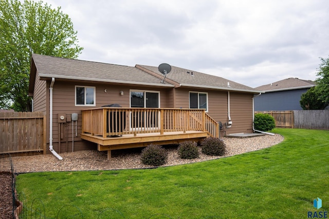 204 W Mountain Ash St, Brandon, SD 57005 - rear view of house featuring a fenced backyard, a wooden deck, and a shingled roof