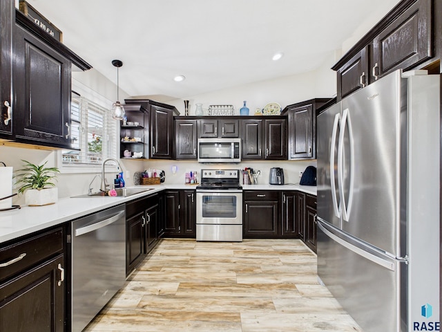 204 W Mountain Ash St, Brandon, SD 57005 - kitchen featuring stainless steel appliances, light countertops, light wood-type flooring, hanging light fixtures, and recessed lighting
