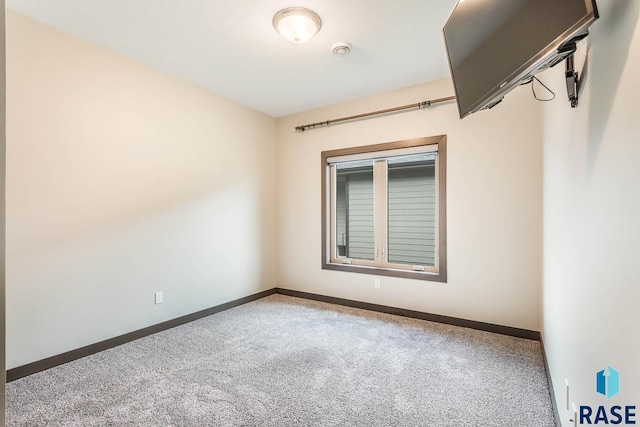 252 Devitt Dr, Harrisburg, SD 57032 - carpeted empty room with baseboards and a smoke detector