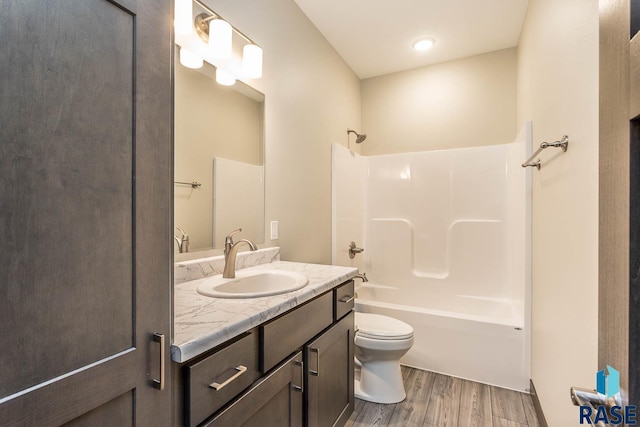 252 Devitt Dr, Harrisburg, SD 57032 - bathroom with wood finished floors, vanity, and tub / shower combination