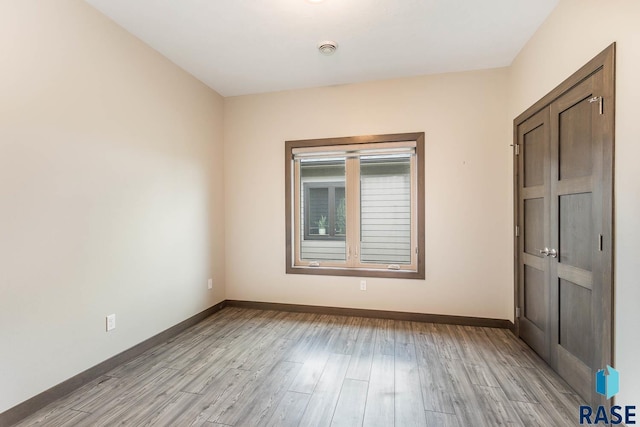 252 Devitt Dr, Harrisburg, SD 57032 - empty room with baseboards and light wood-type flooring