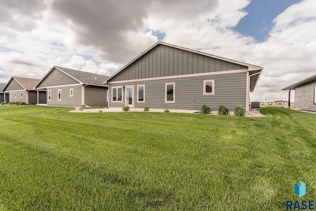 252 Devitt Dr, Harrisburg, SD 57032 - rear view of house with a lawn and board and batten siding